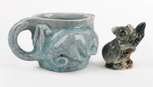 A studio pottery jug with crackle glaze and possum decoration; together with a DARBYSHIRE ceramic koala figure, (2 items), the jug 8cm high, 14cm wide