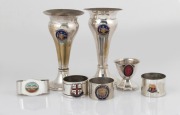 Australian silver plated vases, napkin rings and egg cup, each decorated in enamel, early to mid 20th century, (7 items), ​​​​​​​the vases 14cm high.