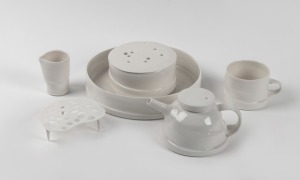 JANET DeBOOS Australian white ceramic tea set for one with trivet and lidded box, (6 items), ​​​​​​​incised signature to base, the tray 22cm across