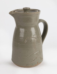 HAROLD HUGHAN celadon glazed lidded jug with sgraffito decoration, signed "Hughan" with additional impressed Glen Iris mark, 21cm high