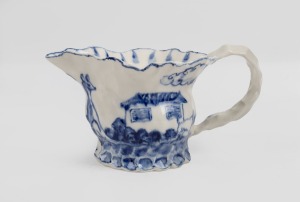 GERRY WEDD blue and white glazed hand-painted pottery jug with kangaroo and dog in landscape, signed "G. W., '07", 9cm high, 16cm wide