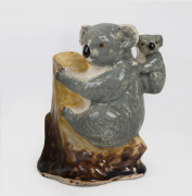 A porcelain koala figural group, 20th century, ​​​​​​​13.5cm high.