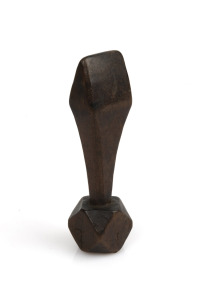 28 · An antique carved timber sail seam rubber, 19th century, 12cm high
