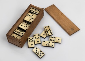 Antique whalebone and ebony dominoes in timber case, 19th century, the case 16cm wide