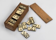 Antique whalebone and ebony dominoes in timber case, 19th century, the case 16cm wide