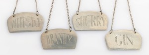 Four assorted Australian silver decanter labels, including Whisky, Sherry, Brandy and Gin, 20th century, stamped "Silv." or "Stg. Sil.", 4cm wide