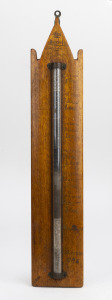 BROKEN HILL SOUVENIR 1925 mineral ore samples assembled in glass tube and mounted on eucalyptus backing board with hand-painted notations to the side, 49cm high.