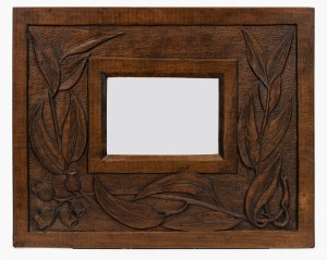 An Australian Arts & Crafts kauri pine picture frame, carved with gum leaves and gumnuts, early 20th century, 35 x 44cm