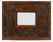 An Australian Arts & Crafts kauri pine picture frame, carved with gum leaves and gumnuts, early 20th century, 35 x 44cm