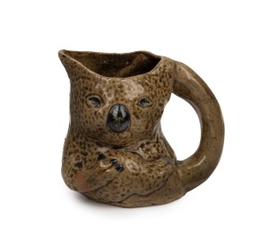 STAN & GEOFF GILBERT (MERRIC BOYD design) pottery koala jug, signed "Koala, Vic. Australia, 1929", 10.5cm high.