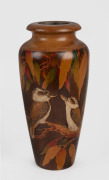 An Australian pokerwork vase decorated with kookaburras in gum tree, circa 1925, incised signature to base (illegible), 25cm high.