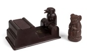 A vintage bakelite kookaburra cigarette dispenser; together with a POTTER & MOORE bakelite koala perfume case, (2 items), the dispenser 18.5cm long.