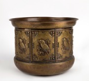 An antique embossed brass jardiniere with kookaburras, gumnuts and gum leaves, 19th/20th century, 20cm high, 27cm diameter.