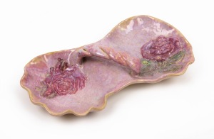 UNA DEERBON pink glazed pottery dish with rose decoration and rope twist handle, incised "DEERBON", ​​​​​​​24cm wide.
