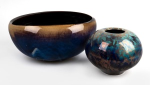 GREG DALY blue and brown glazed studio pottery fruit bowl and a blue glazed vase with lustre highlights, (2 items), both signed "Daly", ​​​​​​​the bowl 17cm high, 34cm wide, the vase 16cm high, 18cm wide.