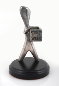 T.V. WEEK "SILVER LOGIE" on ebonized timber plinth, 20cm high.