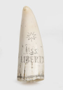 A scrimshaw whale's tooth with engraved portrait of LIBERTY, ​​​​​​​10.5cm high. - 2