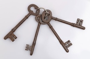 Four convict prison cell door keys with broad arrow marks, 19th century, each approximately 11cm long.
