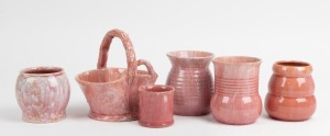 JOHN CAMPBELL group of six pink glazed pottery vases, all incised "John Campbell, Tasmania", ​​​​​​​the basket example 15cm high.