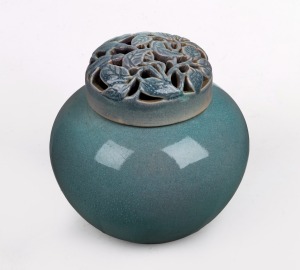 KLYTIE PATE pottery ginger jar with pierced leaf decorated lid, glazed in turquoise with mauve interior, incised "Klytie Pate", 17cm high.
