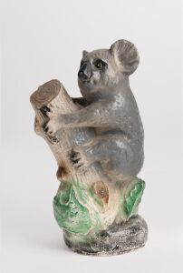 A vintage hand-painted fired plaster koala statue, 20th century, 33cm high