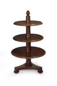 283 · A rare antique Australian cedar graduated circular three tier dumbwaiter with tri-form base, squat bun feet with concealed castors and central column terminating with a cedar acorn finial, circa 1850. Note: This form of dumbwaiter is very seldom seen in Australian furniture. 104cm high, the lower tier 58cm diameter.