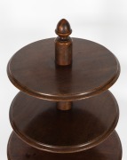 A rare antique Australian cedar graduated circular three tier dumbwaiter with tri-form base, squat bun feet with concealed castors and central column terminating with a cedar acorn finial, circa 1850. Note: This form of dumbwaiter is very seldom seen in A - 2