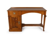 ROBERT PRENZEL antique Australian oak single pedestal hall table with carved waratah decoration to the corners and gumnut and gum leaf carving to the stippled panel door, original nickle plated hardware, tapering legs and lower footrest shelf, the side of