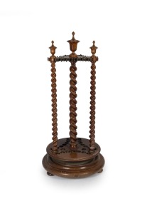 ALCOCK (attributed) handsome antique Australian Tasmanian blackwood revolving billiard cue stand with barley twist supports and lidded urn finials, circa 1870, accompanied by three billiard cues, 126cm high, 59cm diameter.