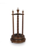 ALCOCK (attributed) handsome antique Australian Tasmanian blackwood revolving billiard cue stand with barley twist supports and lidded urn finials, circa 1870, accompanied by three billiard cues, 126cm high, 59cm diameter.