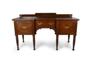An early and rare Colonial Australian cedar inverted breakfront six legged sideboard, with casuarina inlay to the drawer fronts, finely turned legs, cross-banded edge, pine inlaid top and full cedar secondary timbers, Sydney origin, circa 1820.