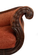 An early Colonial Australian cedar chaise lounge with cross-banded and carved facings, reeded blocks and paterae, vase turned legs with original brass castors, and very rare original leather strapping, Northern Tasmanian origin, circa 1830, - 2
