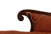 An early Colonial Australian cedar chaise lounge with cross-banded and carved facings, reeded blocks and paterae, vase turned legs with original brass castors, and very rare original leather strapping, Northern Tasmanian origin, circa 1830, - 4