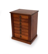 An antique Australian stained kauri pine seven drawer miniature stationary chest in the Wellington style, 19th century, 54cm high, 43cm wide, 33cm deep. - 2