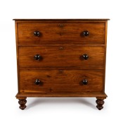 A Colonial Australian blackwood three drawer chest with Baltic pine secondary timbers resting on turned vase bun feet, Tasmanian origin, circa 1850, 99cm high, 96cm wide, 48cm deep.