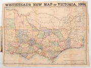 Whitehead's New Map of Victoria 1884, laid down on linen and folded within the original claret boards (spine repaired) with gilt lettering. 43 x 58cm (opened out). - 2