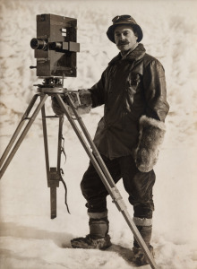 TERRA NOVA EXPEDITION: Original silver gelatin photograph, 12 x 16.5cm, numbered '514' in pencil in Herbert Ponting's hand, known to have been titled by Ponting "Herbert Ponting with his cinematograph".