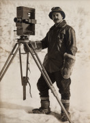 TERRA NOVA EXPEDITION: Original silver gelatin photograph, 12 x 16.5cm, numbered '514' in pencil in Herbert Ponting's hand, known to have been titled by Ponting "Herbert Ponting with his cinematograph".