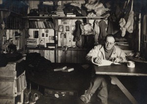 TERRA NOVA EXPEDITION: Original silver gelatin photograph, 17 x 12cm, numbered '341' in pencil in Herbert Ponting's hand, known to have been titled by Ponting "Capt Scott writing his journal in the Winterquarters Hut".