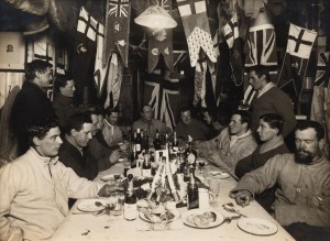 TERRA NOVA EXPEDITION: Original silver gelatin photograph, 16.5 x 11.5cm, numbered '300' in pencil in Herbert Ponting's hand, known to have been titled by Ponting "Midwinter Day Dinner at Winterquarters Hut. June 22nd 1911".