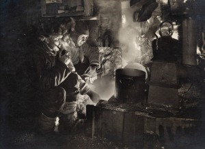 TERRA NOVA EXPEDITION: Original silver gelatin photograph, 16.5 x 11.5cm, numbered '282' in pencil in Herbert Ponting's hand, known to have been titled by Ponting "Meares and Capt Oates at the blubber stove, cooking food for the dogs".