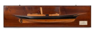 "S.Y. CORONA" half hull model boat, pine on mahogany backboard with hand-painted highlights and ivoreen plaque describing details of the vessel, Scotland, circa 1910, Note: Later serves in the US under the name USS Corona. Original builders presentation model. ​​​​​​​36 x 142cm.