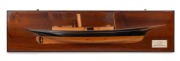 "S.Y. CORONA" half hull model boat, pine on mahogany backboard with hand-painted highlights and ivoreen plaque describing details of the vessel, Scotland, circa 1910, Note: Later serves in the US under the name USS Corona. Original builders presentation m