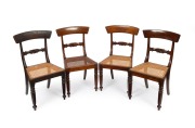 A rare set of four Colonial Australian cedar spade back Trafalgar chairs with scroll carved back splats and cane seats, Sydney origin, circa 1835, 89cm high.