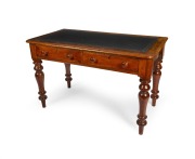 An antique Australian cedar two drawer desk with gilt tooled embossed black leather insert top, 19th century, 77cm high, 122cm wide, 64cm deep