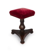 A fine quality Colonial Australian cedar revolving piano seat with lotus carved baluster shaped column, centurion skirt and tri-form base, Tasmanian origin, circa 1840, 52cm high