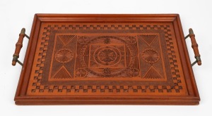 199 · An antique Australian chip carved kauri pine serving tray, early 20th century, ​​​​​​​54cm across the handles.