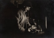 TERRA NOVA EXPEDITION: Original silver gelatin photograph, 16.5 x 11.5cm, numbered '312' in pencil in Herbert Ponting's hand, known to have been titled by Ponting "Herbert Ponting at work in the Darkroom at Winterquarters Hut. July 22nd 1911".