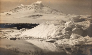 TERRA NOVA EXPEDITION: Original silver gelatin photograph, 15 x 9cm, numbered '103' in pencil in Herbert Ponting's hand, known to have been titled by Ponting "Erebus and ice reflection foreground. Jan. 7th 1911.".