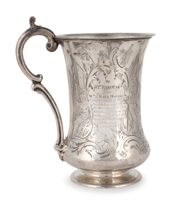 An antique sterling silver presentation tankard, engraved "To Wm. KANE Esq. from Wm. & MARY MORRIS As A Slight Mark Of Their Friendship & Esteem For His Attention & Kindness To Them In Sickness Whilst On Board The ANGLESEY, Melbourne, Nov. 1855". Manufactured by George Angell of London, this piece has been handsomely engraved with a fine shipping scene and maritime motif in Melbourne during the beginning of the gold rush boom. 14.5cm high, 189 grams.